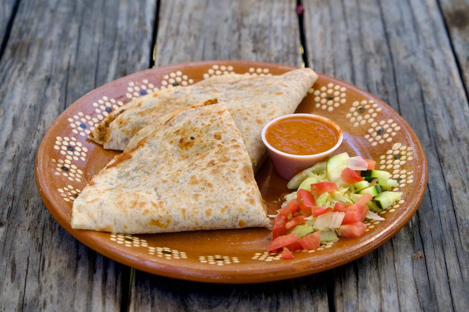 Flour tortilla montado with salsa from Itaa’s Street Kitchen